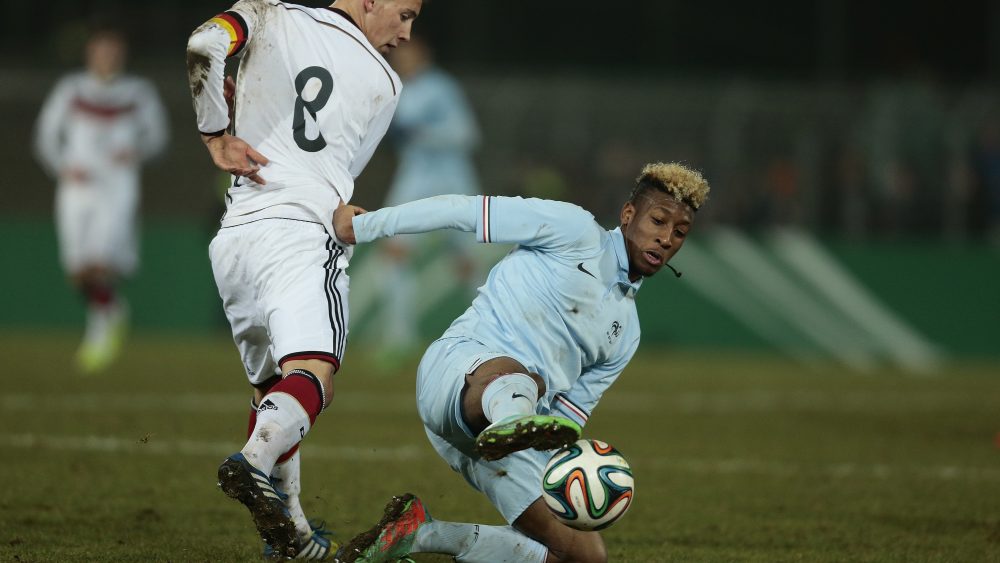 (L) of Germany and (R) of France compete for the ball during the U18 International Friendly Match match between Germany and France at Stadion an der Lohmuehle on March 5, 2014 in Luebeck, Germany.