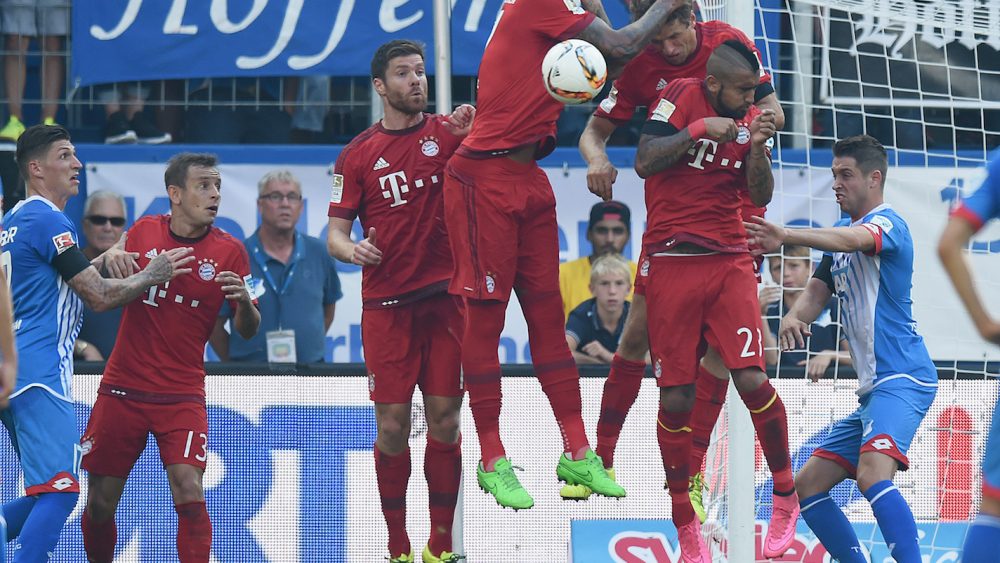 SINSHEIM, GERMANY - AUGUST 22: Jerome Boateng of Muenchen blocks a free kick with his hand during the Bundesliga match between 1899 Hoffenheim and FC Bayern Muenchen at Wirsol Rhein-Neckar-Arena on August 22, 2015 in Sinsheim, Germany. (Photo by Matthias Hangst/Bongarts/Getty Images)