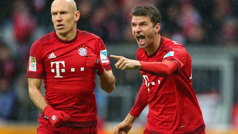 MUNICH, GERMANY - FEBRUARY 20: Thomas Mueller (R) of Muenchen celebrates scoring the first team goal with his team mate Arjen Robben during the Bundesliga match between FC Bayern Muenchen and SV Darmstadt 98 at Allianz Arena on February 20, 2016 in Munich, Germany. (Photo by A. Hassenstein/Getty Images for FC Bayern)