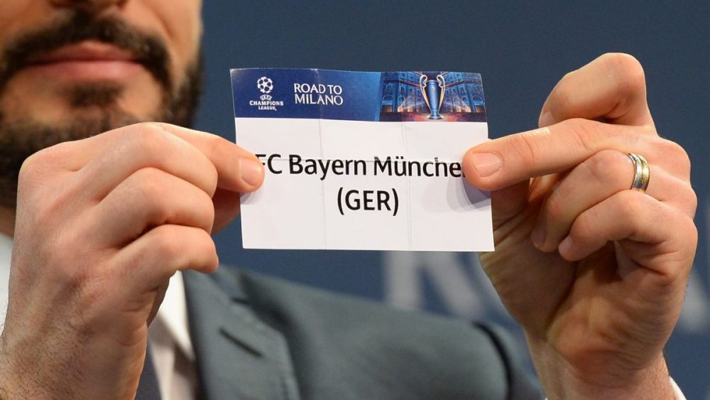 Italian former football player Gianluca Zambrotta shows a piece of paper bearing the name of Bayern Munich football club during the quarter-final draw for the UEFA Champions League, on March 18 at the UEFA headquarters in Nyon. AFP PHOTO / JEAN-GUY PYTHON / AFP / JEAN-GUY PYTHON