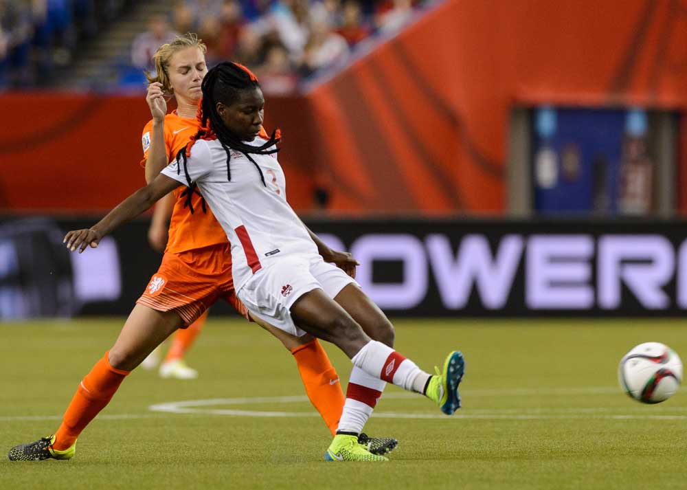 MONTREAL, QC - JUNE 15: Vivianne Miedema #9 of the Netherlands challenges Kadeisha Buchanan #3 of Canada during the 2015 FIFA Women's World Cup Group A match at Olympic Stadium on June 15, 2015 in Montreal, Quebec, Canada. (Photo by Minas Panagiotakis/Getty Images)
