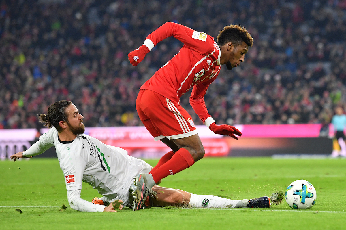 MUNICH, GERMANY - DECEMBER 02: Kingsley Coman of Bayern Muenchen (r) is fouled by Martin Harnik of Hannover that leads to a penalty for Muenchen during the Bundesliga match between FC Bayern Muenchen and Hannover 96 at Allianz Arena on December 2, 2017 in Munich, Germany. (Photo by Sebastian Widmann/Bongarts/Getty Images)