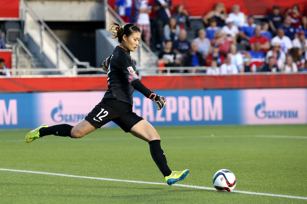 OTTAWA, ON - JUNE 26: Wang Fei #12 of China clears the ball in the second half against the United States in the FIFA Women's World Cup 2015 Quarter Final match at Lansdowne Stadium on June 26, 2015 in Ottawa, Canada. (Photo by Andre Ringuette/Freestyle Photo/Getty Images)