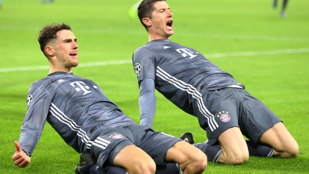 AMSTERDAM, NETHERLANDS - DECEMBER 12: Leon Goretzka and Robert Lewandowski of Bayern Munich celebrate after Robert Lewandowski scores his sides second goal during the UEFA Champions League Group E match between Ajax and FC Bayern Muenchen at Johan Cruyff Arena on December 12, 2018 in Amsterdam, Netherlands. (Photo by Dean Mouhtaropoulos/Getty Images)