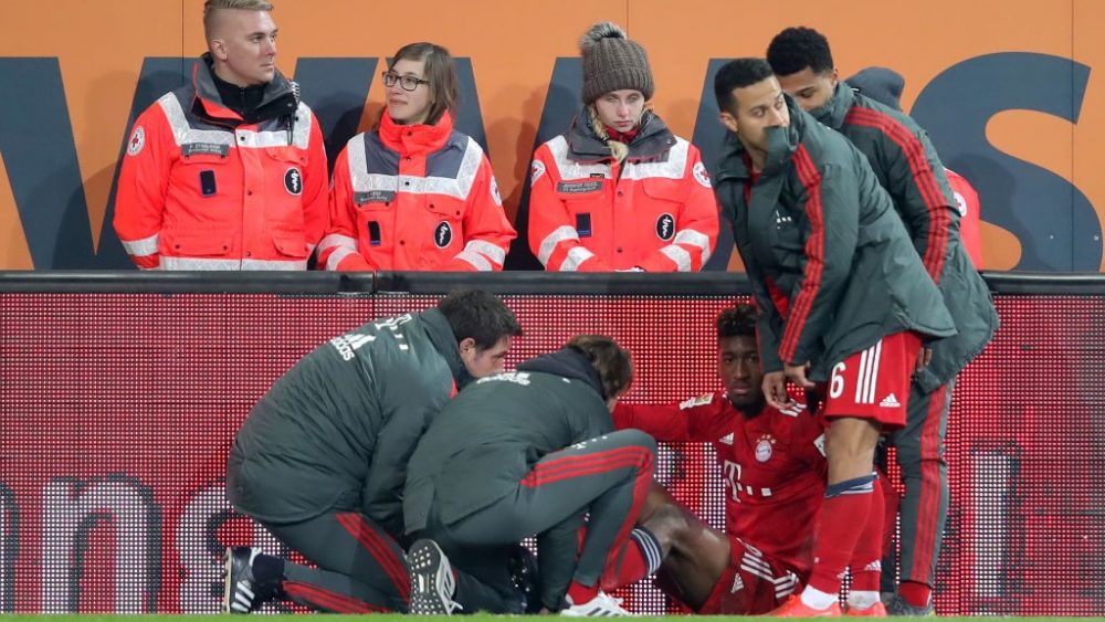 AUGSBURG, GERMANY - FEBRUARY 15: Kingsley Coman of Muenchen sits injured on the pitch during the Bundesliga match between FC Augsburg and FC Bayern Muenchen at WWK-Arena on February 15, 2019 in Augsburg, Germany. (Photo by Alexander Hassenstein/Bongarts/Getty Images)
