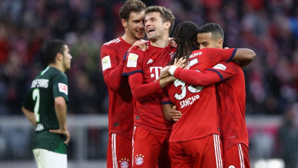 Thomas Mueller of Bayern Munich celebrates with teammates after scoring his team's fourth goal during the Bundesliga match between FC Bayern Muenchen and VfL Wolfsburg at Allianz Arena on March 09, 2019 in Munich, Germany. (Photo by Alex Grimm/Bongarts/Getty Images)