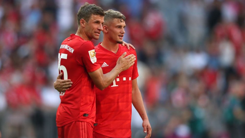 MUNICH, GERMANY - AUGUST 31: Thomas Mueller of FC Bayern Muenchen reacts to his team mate Michael Cuisance after the Bundesliga match between FC Bayern Muenchen and 1. FSV Mainz 05 at Allianz Arena on August 31, 2019 in Munich, Germany. (Photo by Alexander Hassenstein/Bongarts/Getty Images)