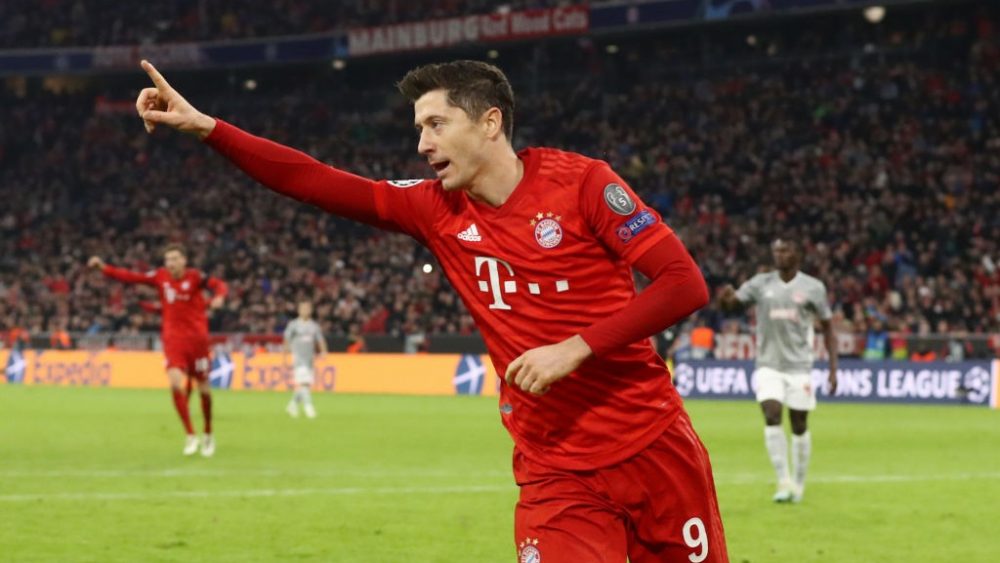 MUNICH, GERMANY - NOVEMBER 06: Robert Lewandowski of FC Bayern Munich celebrates after scoring his team's first goal during the UEFA Champions League group B match between Bayern Muenchen and Olympiacos FC at Allianz Arena on November 06, 2019 in Munich, Germany. (Photo by Alexander Hassenstein/Bongarts/Getty Images)