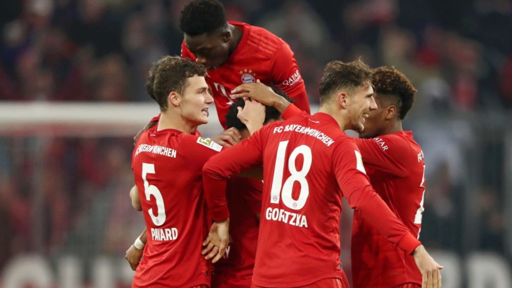 MUNICH, GERMANY - NOVEMBER 09: Serge Gnabry of FC Bayern Munich (obscured) celebrates with teammates after scoring his team's second goal during the Bundesliga match between FC Bayern Muenchen and Borussia Dortmund at Allianz Arena on November 09, 2019 in Munich, Germany. (Photo by Alexander Hassenstein/Bongarts/Getty Images)