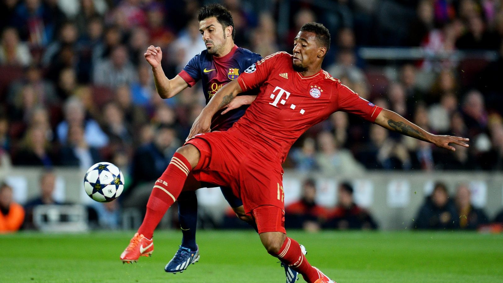Jerome Boateng im Zweikampf mit Lionel Messi
